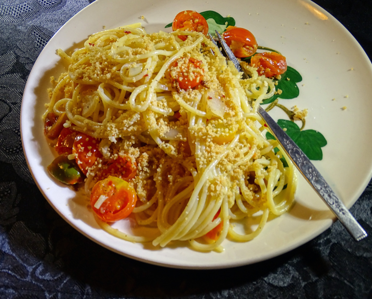 plate of noodles and roasted cherry tomatoes